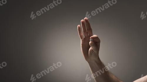 Preview: partial view of male holding pillow on grey background