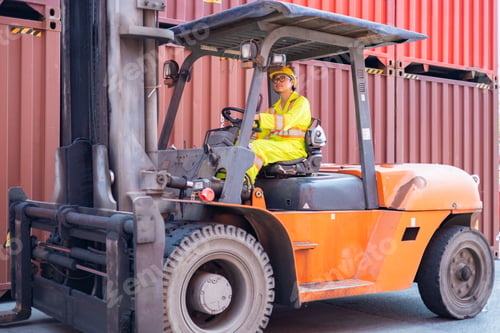 Preview: Engineer loads goods by forklift to stack containers
