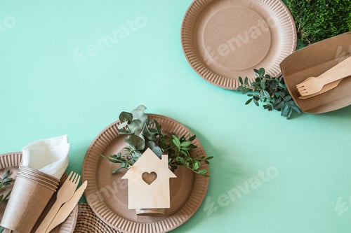 Preview: Eco-friendly disposable utensils made of bamboo wood and paper on a trending background.