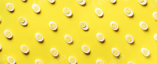 Preview: Food concept with boiled eggs pattern on yellow background. Top view. Creative pattern in minimal