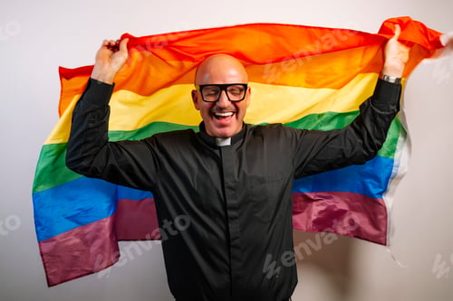 Preview: Portrait of a priest with a multi-colored LGBT flag.