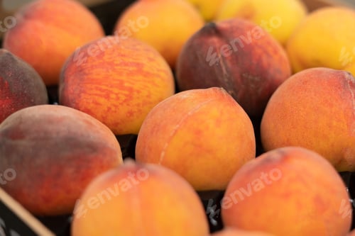 Preview: close up beatiful fresh raw peaches in a wooden crate