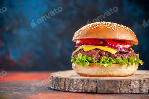 Preview: front view tasty cheeseburger with meat tomatoes and green salad on dark blue background sandwich