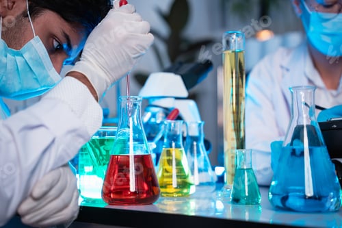 Preview: A group of young scientists are conducting experiments in the lab using a microscope.