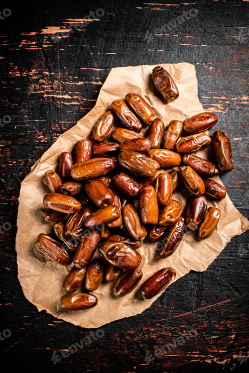 Preview: A pile of dates on paper on the table.