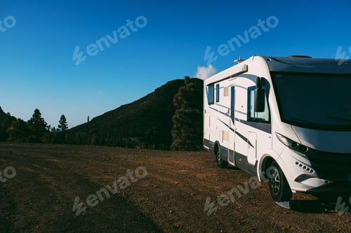 Preview: Modern camper van motorhome parked in the nature with sky view. Concept of people and travel