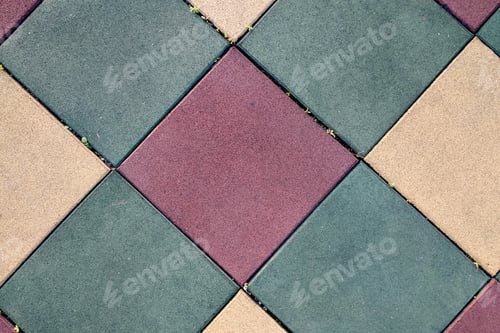 Preview: Close up of soft rubber tiles for covering at outdoor gym of stadium at preschool yard