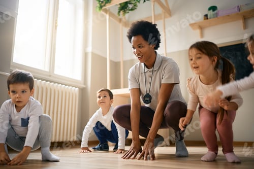 Preview: Children and Instructor Crouching during Exercise Session Indoors