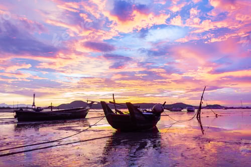 Preview: beautiful sunrise with boat on the sea at Phuket province, Thailand.