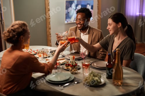 Preview: Friends Enjoying Dinner Party Indoors