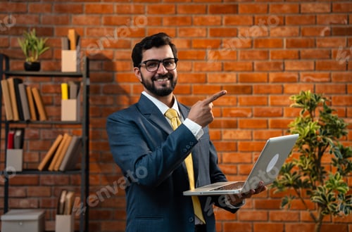 Preview: Asian businessman using laptop in cozy office, corporate work on digital device