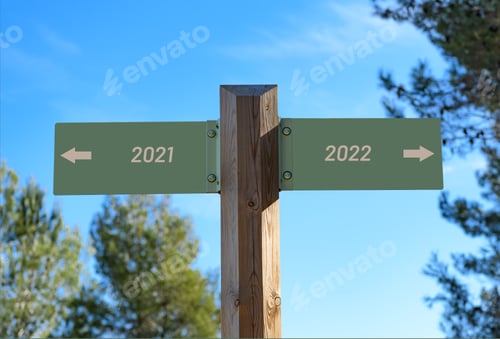 Preview: Street sign pointing opposite directions for "2021" and "2022"