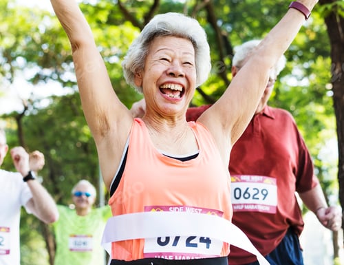 Preview: Elderly asian woman reaching the finish line