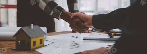 Preview: Architects and engineers working together and handshake business together with blueprints. architect