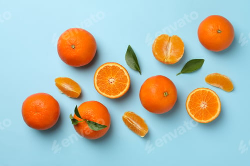 Preview: Ripe sweet mandarins on blue background, top view