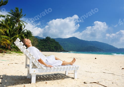 Preview: Man In White Relaxing On A Tropical Beach