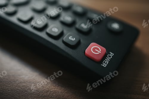 Preview: Closeup shot of remote control for TV on the wooden background