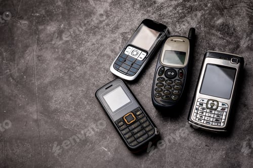 Preview: Many obsoleted cellphones on a grunge background.