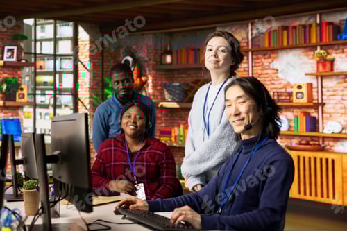 Preview: Portrait of joyful multiethnic call center agents in office