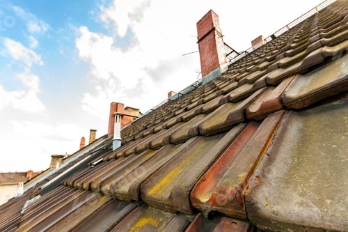 Preview: Old roof with roofing tiles and chimneys