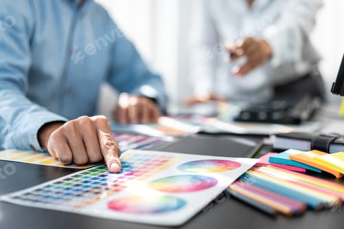 Preview: Team of creative graphic designer working on color swatch samples chart for selection coloring