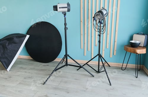 Preview: Professional photo equipment in studio with blue walls