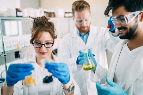 Preview: Group of chemistry students working in laboratory