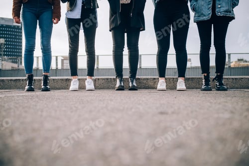 Preview: Friends standing side by side in street, Milan, Italy