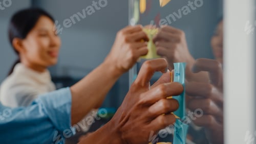 Preview: people stand behind transparent glass wall listen manager pointing progress work and brainstorm.