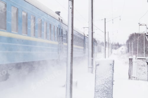 Preview: Passenger train rapidly moving along the snow track