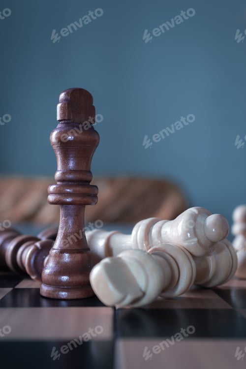 Preview: Vertical shot of chess figures - the concept of overcoming the challenges and succeeding