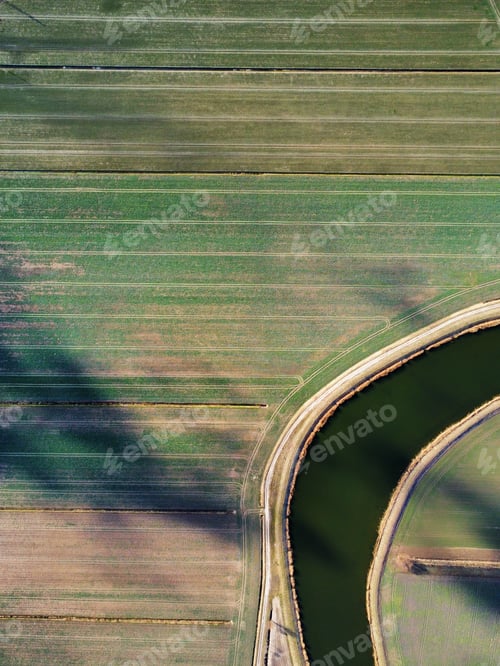Preview: Drone shot of a river in a field
