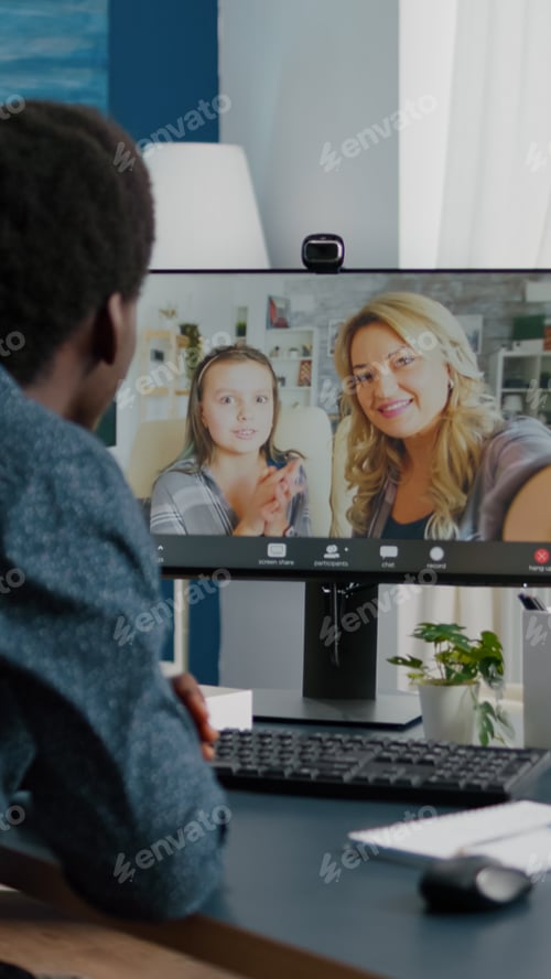 Preview: African american man talking with friends and family using online video call communication