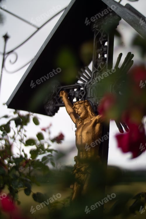 Preview: Vertical closeup shot of a sculpture of Jesus on the cross