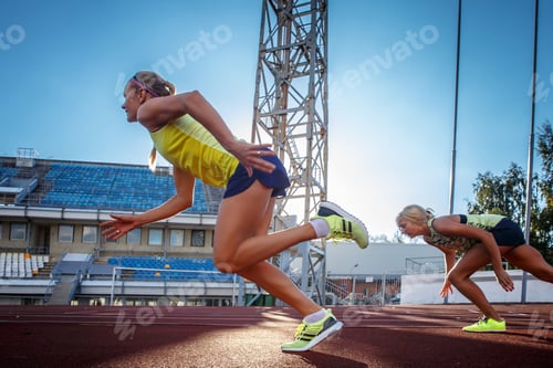Preview: Two female sprinter athlete in the athletics stadium.