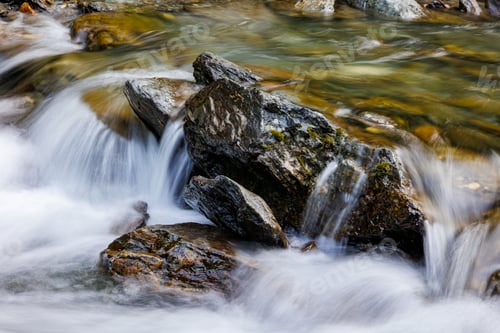 Preview: long exposure of a River stream on mountain valley.