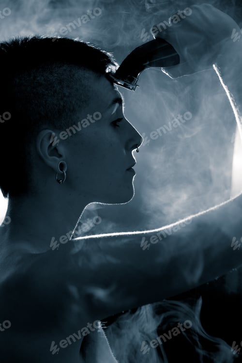 Preview: Woman Shaving Head in Moody Studio Light