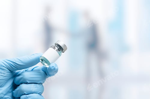 Preview: Hand in medical glove holding a vaccine vial