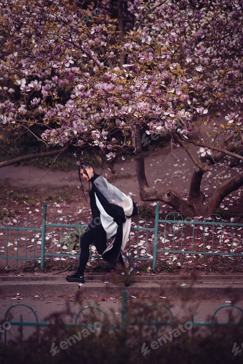 Preview: Beautiful young woman wearing kimono with cherry blossoms, sakura view