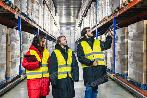 Preview: Logistics team scanning products in cold storage warehouse
