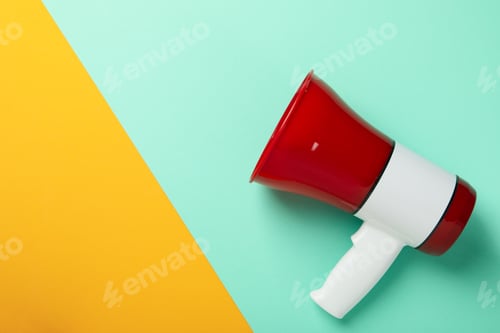 Preview: Megaphone on two tone background, space for text