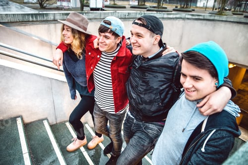 Preview: Young students group walking up stairs at city center