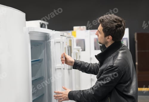 Preview: male customer choosing fridge