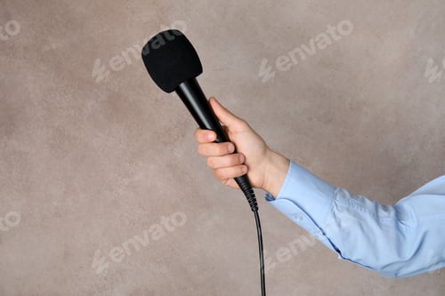 Preview: Woman holding microphone on color background, space for text