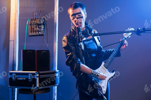 Preview: Female performer with crazy make up playing guitar