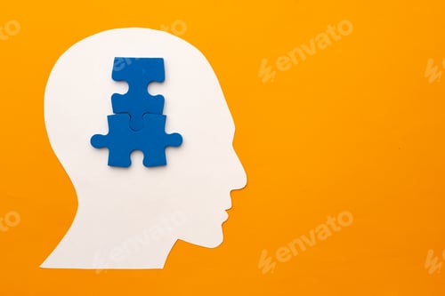 Preview: Papercut head silhouette with puzzle pieces on yellow background
