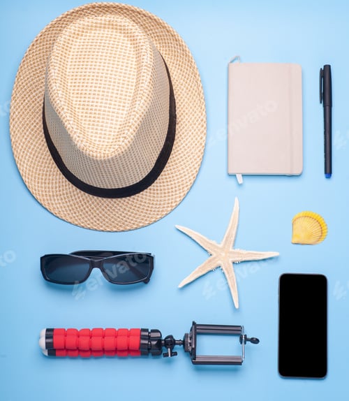 Preview: traveler accessories on blue background, top view