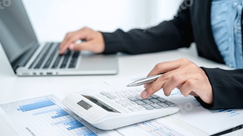Preview: Business woman use calculator to calculate investment figures