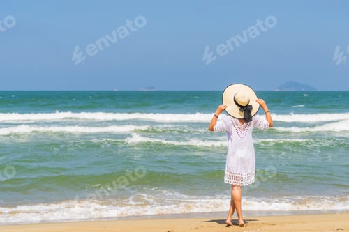 Preview: Woman relaxing at the beach in Hoi An