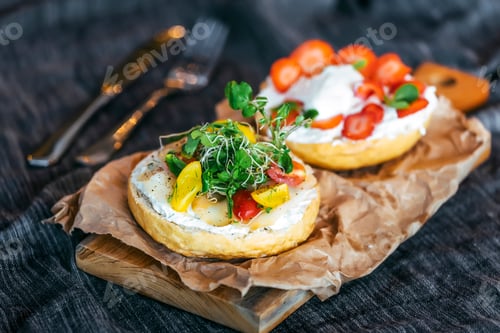 Preview: Tasty Bagels with Fresh Toppings on a Wood Board